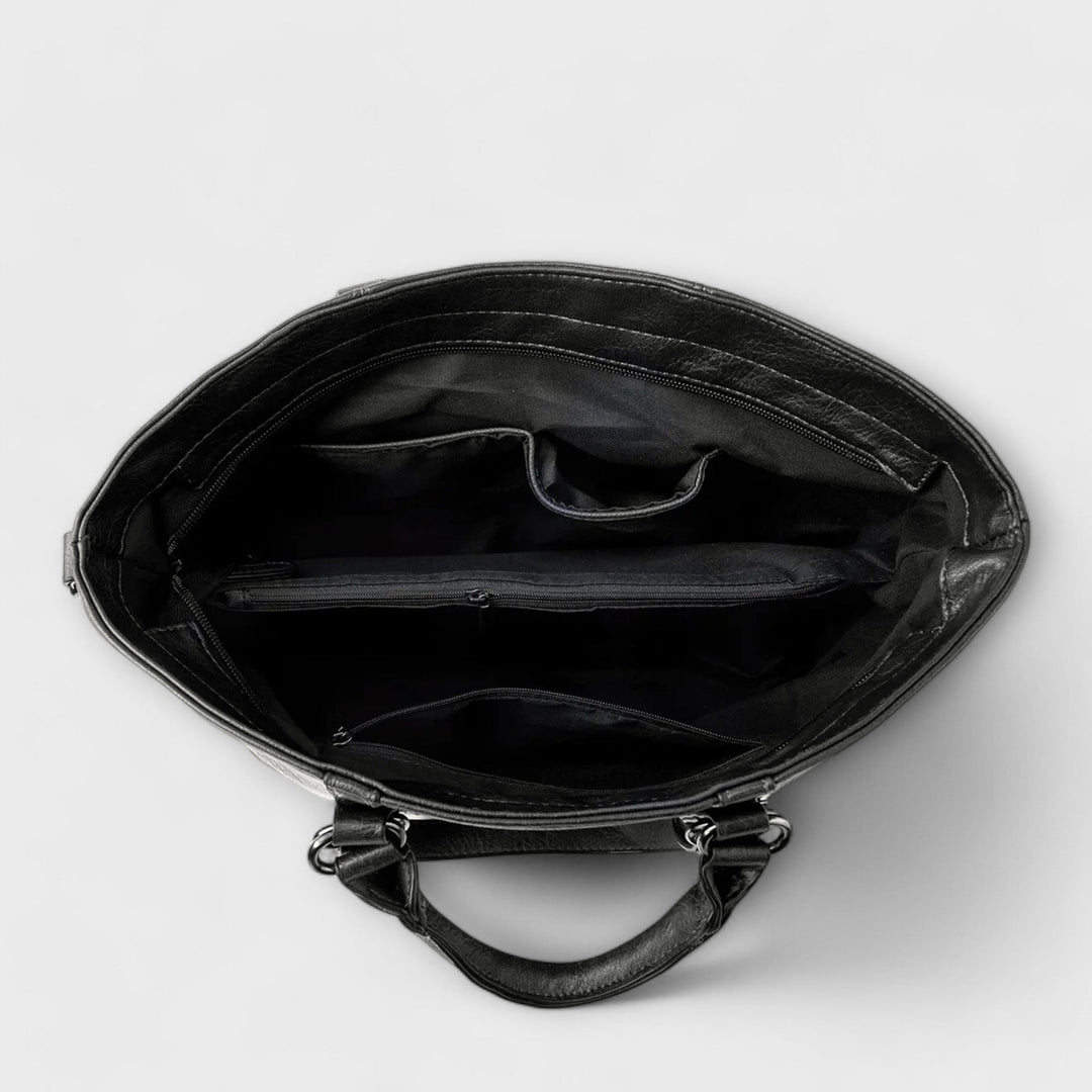 Women's tan leather shoulder bag, a spacious and stylish accessory, perfect for carrying all necessities.