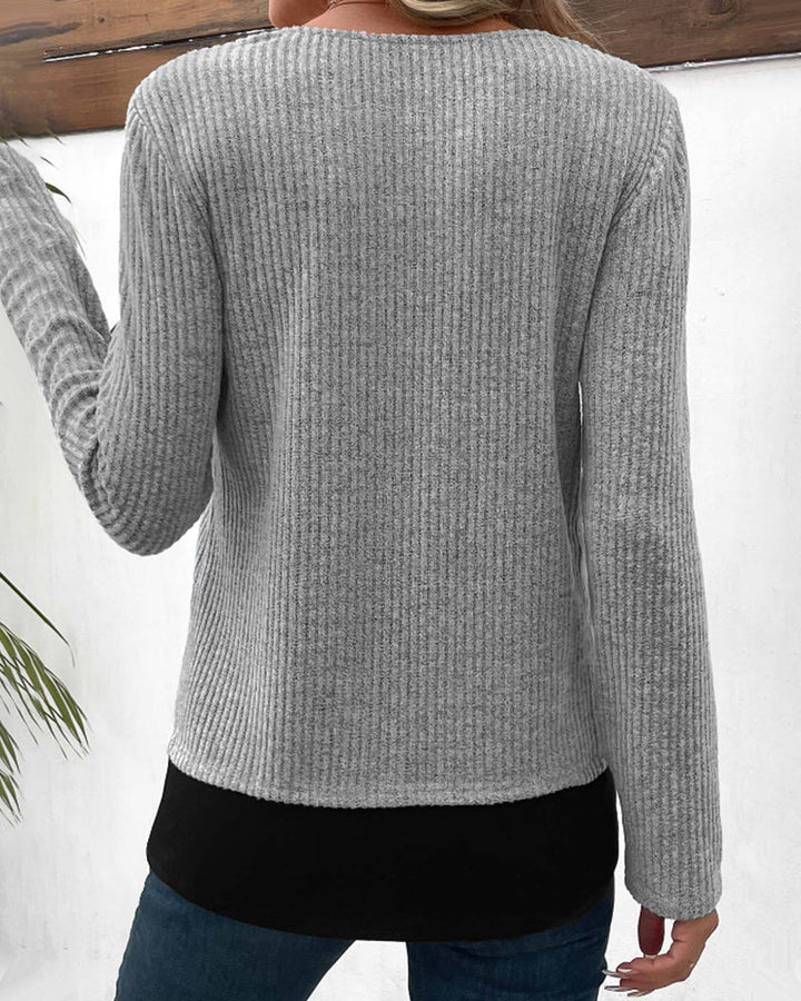 Model in a stylish women's color block patchwork long sleeve layered top. Perfect casual fashion for everyday comfort.