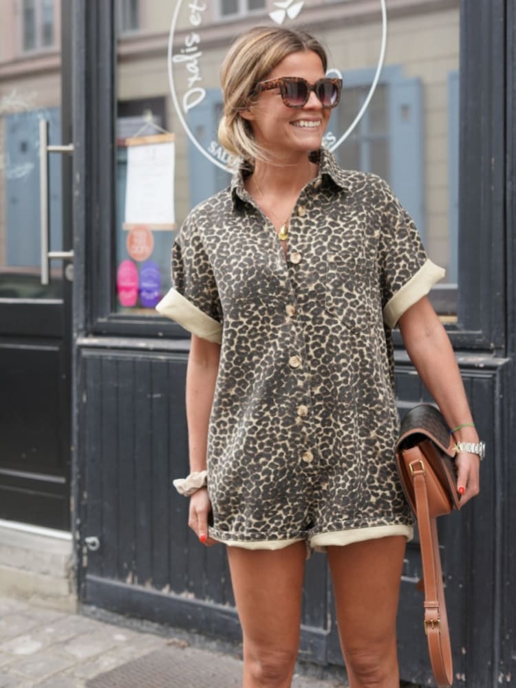 Stylish women's one-piece leopard print romper, ideal casual wear for warm weather.