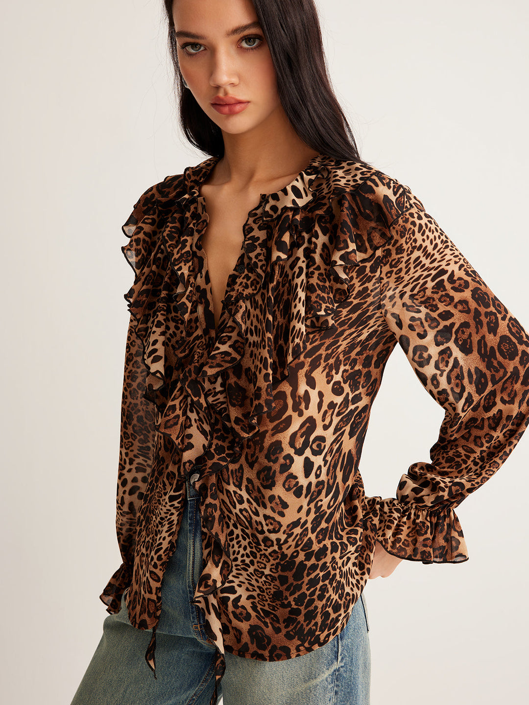 Lightweight leopard print top for women, featuring a chic ruffle neck and sleeveless cut