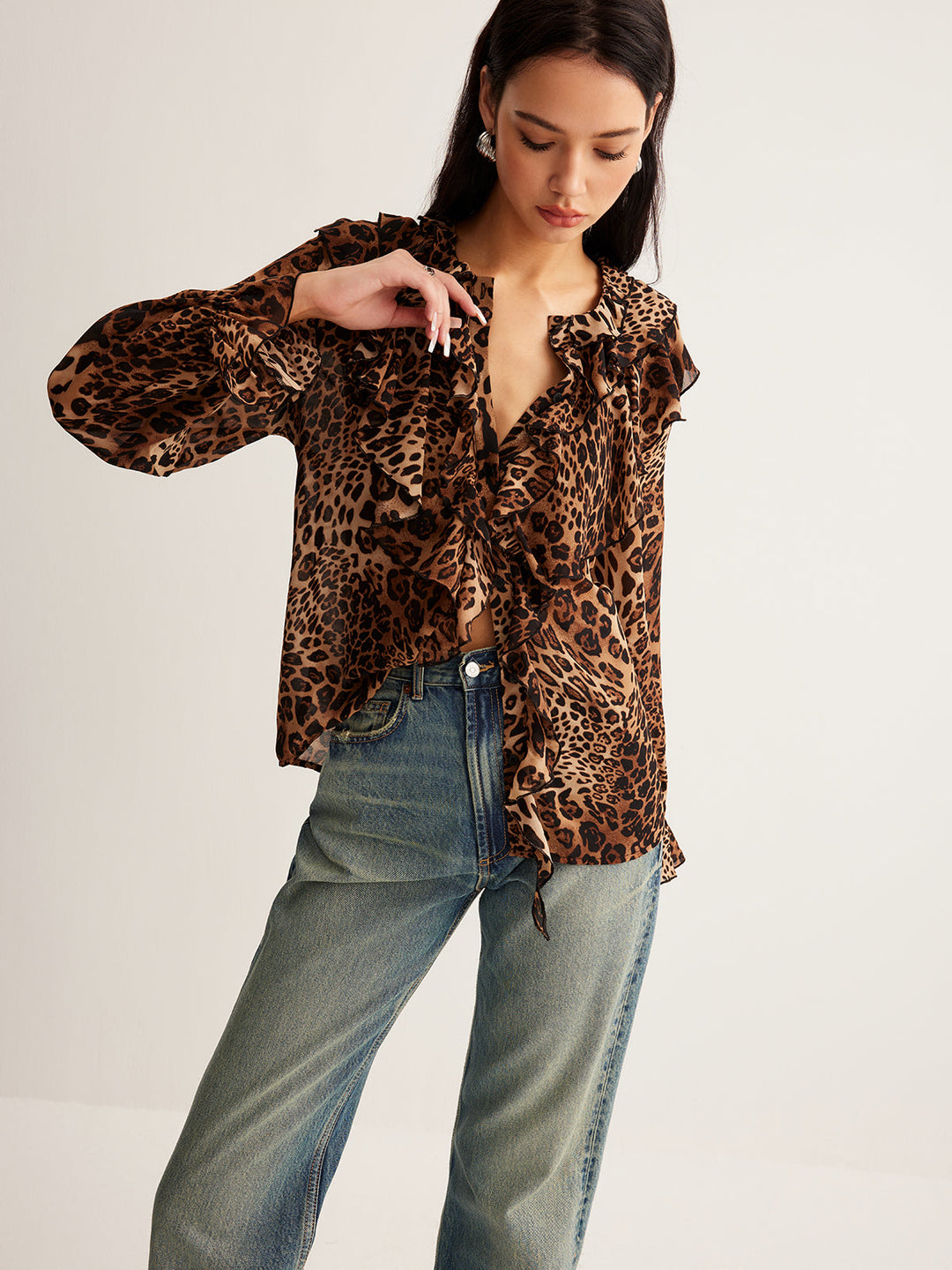 Sleeveless fashion blouse in leopard print with a distinctive ruffle neck detail