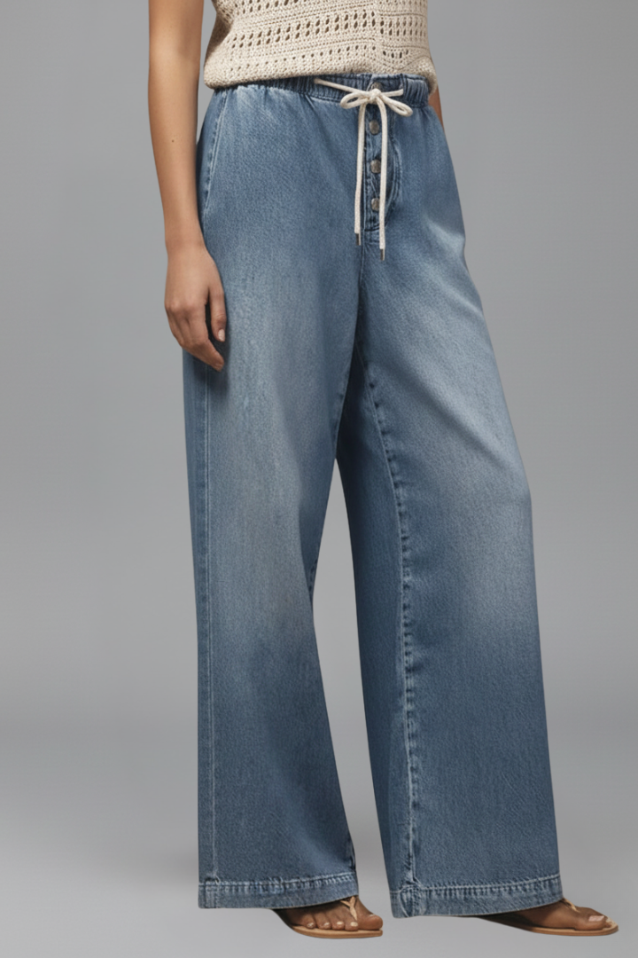 Comfortable light blue women's wide-leg jeans, denim fabric with an adjustable drawstring waist.