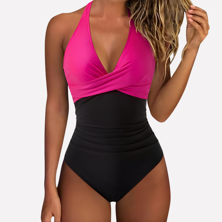 Close-up of pleated detail on women's light control one-piece swimsuit, polyamide elastane fabric