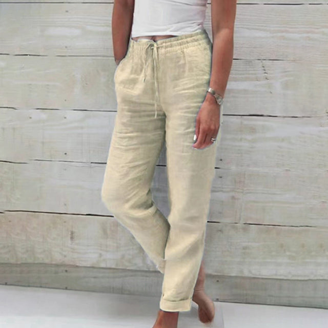 Relaxed fit women's summer trousers featuring a comfortable drawstring waist, perfect for casual wear.