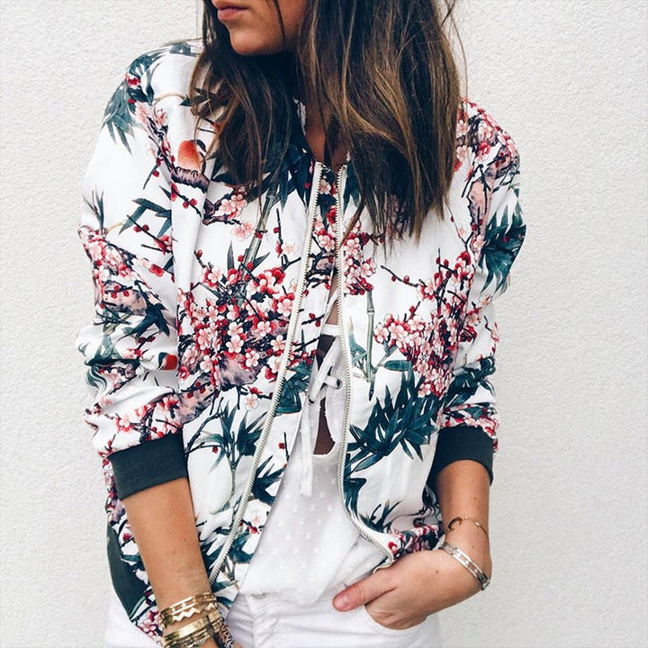Casual women's floral bomber jacket. Lightweight zip-front outerwear, ideal for summer layers and fashion.