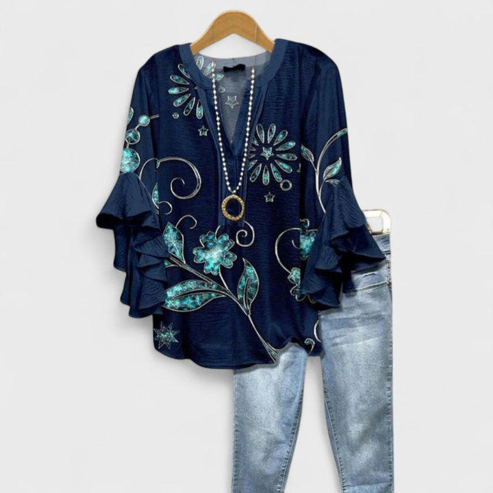 Casual lightweight women's floral blouse with a V-neck and pretty ruffled sleeves for everyday style.