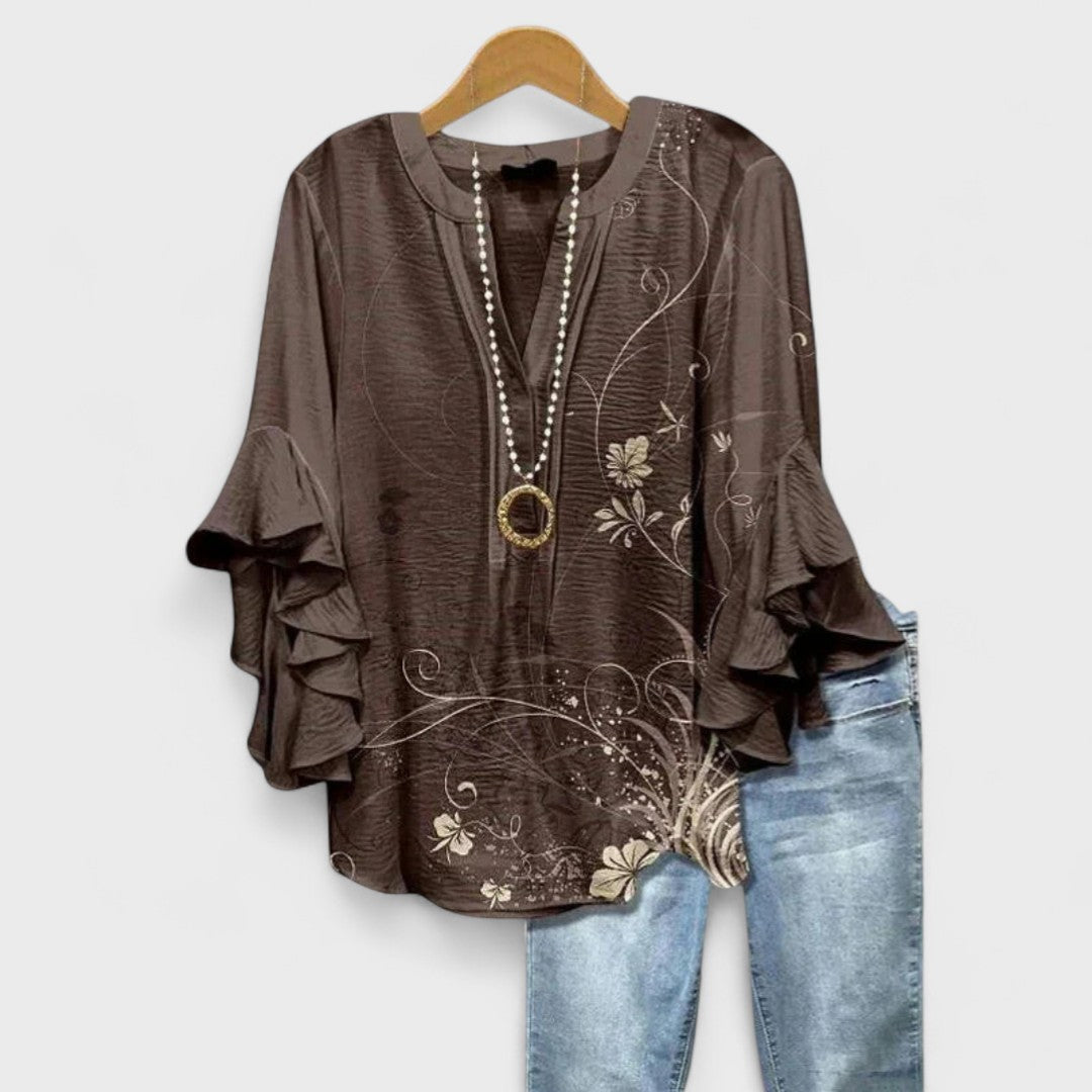 Casual everyday women's top: floral print, lightweight fabric, v-neck, and ruffled sleeves.