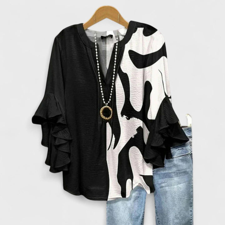 Summer style women's floral blouse, a lightweight V-neck top with chic ruffled sleeve details.