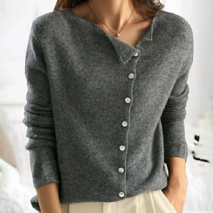 Elegant women's stretch sweater, a lightweight knit cardigan in cream with button accents for casual wear.