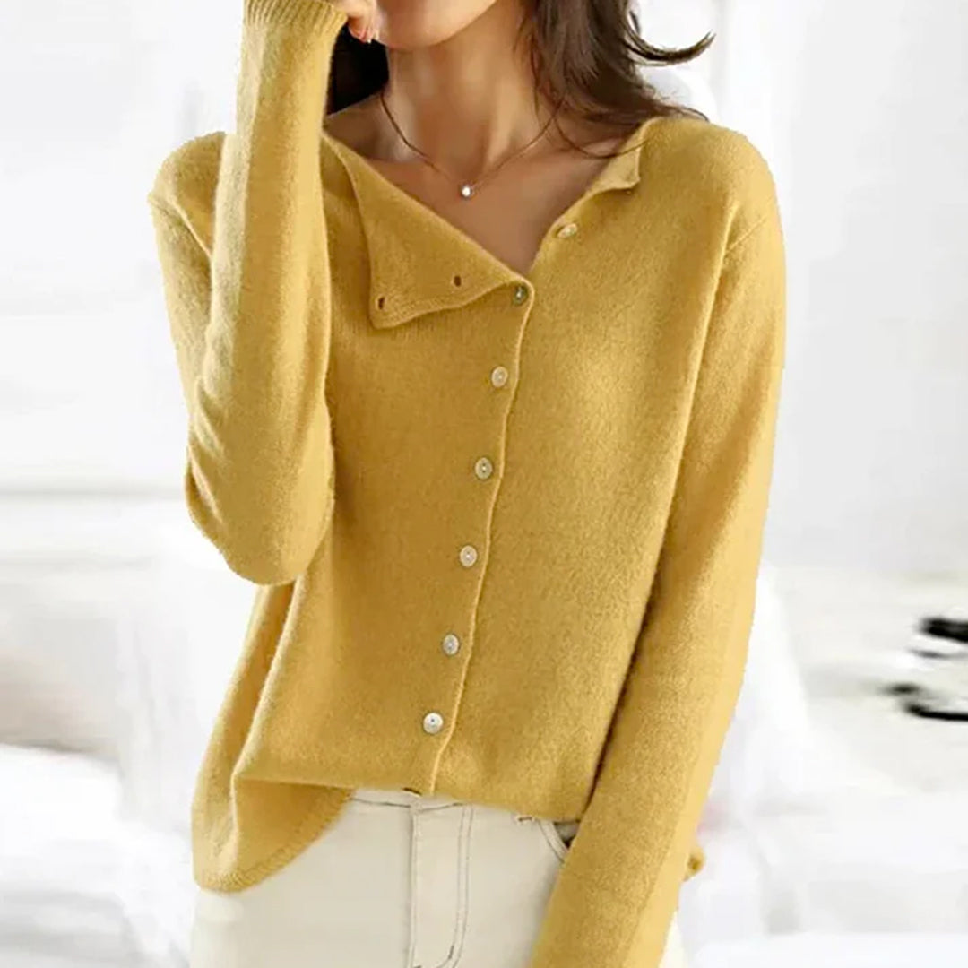 Woman wearing a blue lightweight knit cardigan with button-details, an adaptable stretch sweater for everyday.