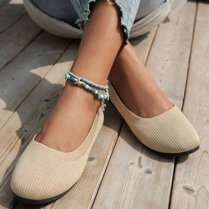 Side view of a blue women's orthopedic summer shoe, emphasizing its lightweight design and arch support.