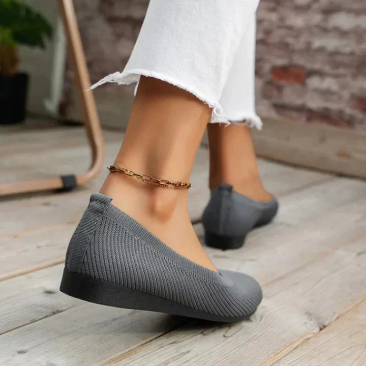 Group of women's orthopedic summer shoes in various colors: pink, blue, grey, and beige, all lightweight.