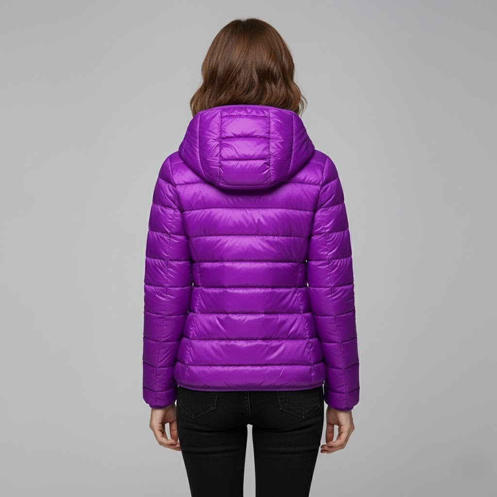 Women's hooded puffer jacket in a deep red, standing out in winter fashion