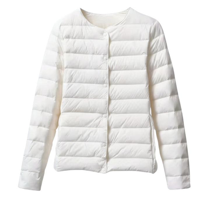 Side profile of women's lightweight puffer jacket, featuring a chic quilted pattern for spring