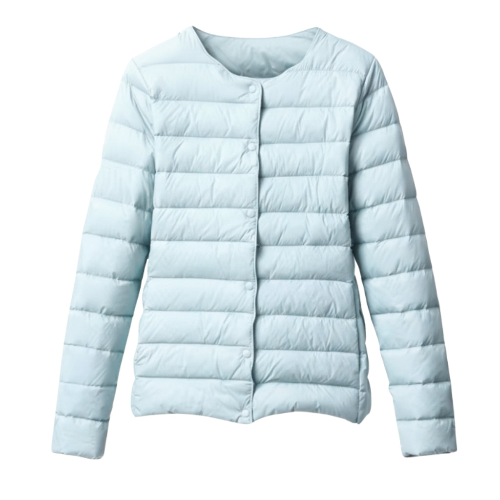 Detail of women's lightweight quilted puffer jacket fabric, showcasing the spring outerwear texture