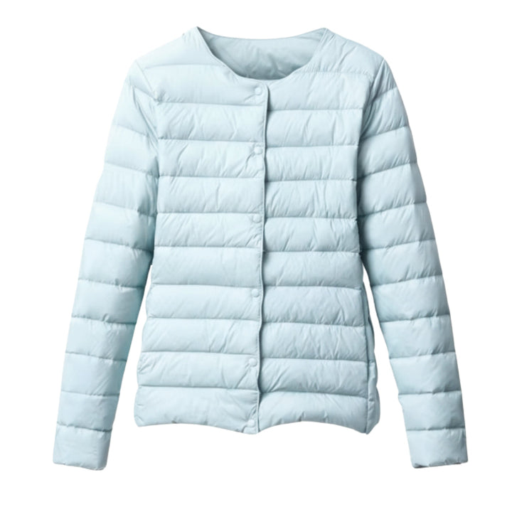 Detail of women's lightweight quilted puffer jacket fabric, showcasing the spring outerwear texture