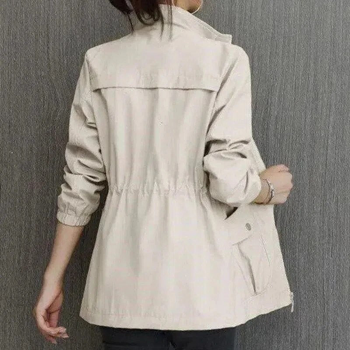 Chic women's short summer jacket, ideal lightweight outerwear for effortless style. Perfect for casual spring fashion.