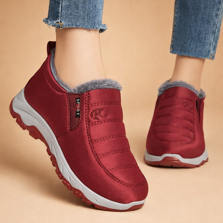 Ladies' lightweight slip-on winter boots in black & red, offering comfortable and warm everyday casual footwear.