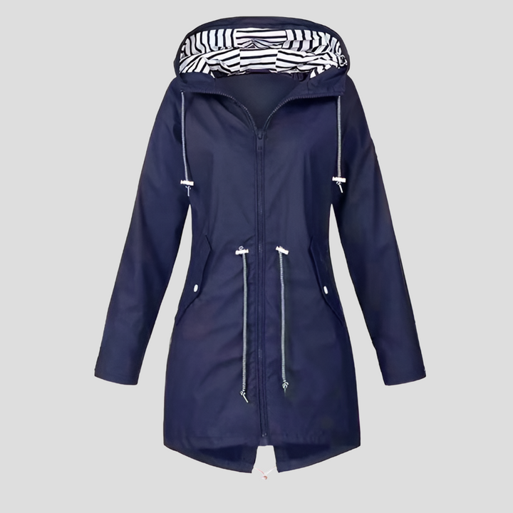 Model wearing a beige women's water-resistant jacket with hood, suitable as spring or fall outerwear.