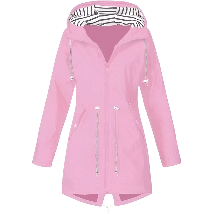 Folded green women's lightweight water-resistant jacket, highlighting its packable design for travel.