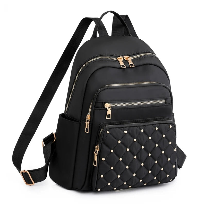 Women's lightweight water-resistant nylon backpack, perfect for travel, school, or daily use.