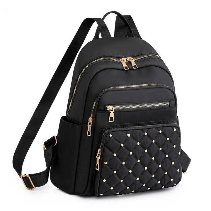 Women's lightweight water-resistant nylon backpack, perfect for travel, school, or daily use.