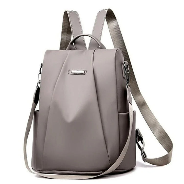 Front view of women's multi-way nylon backpack, highlighting its water-resistant fabric & travel-ready design.