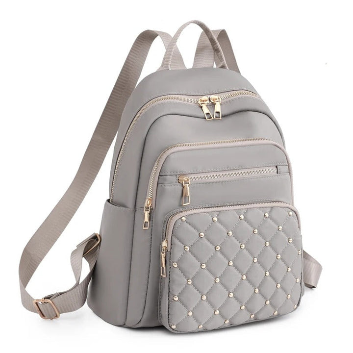 Khaki women's lightweight water-resistant nylon travel backpack, ideal for daily commute.