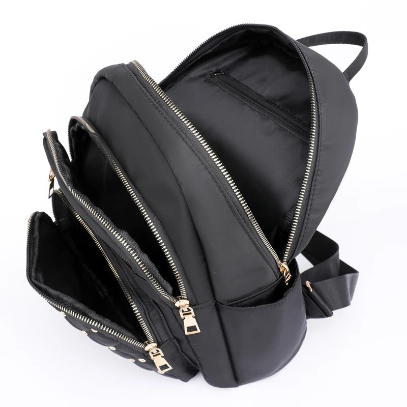 Durable, lightweight water-resistant nylon women's backpack for travel and everyday adventures.