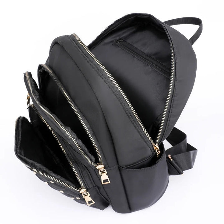 Durable, lightweight water-resistant nylon women's backpack for travel and everyday adventures.