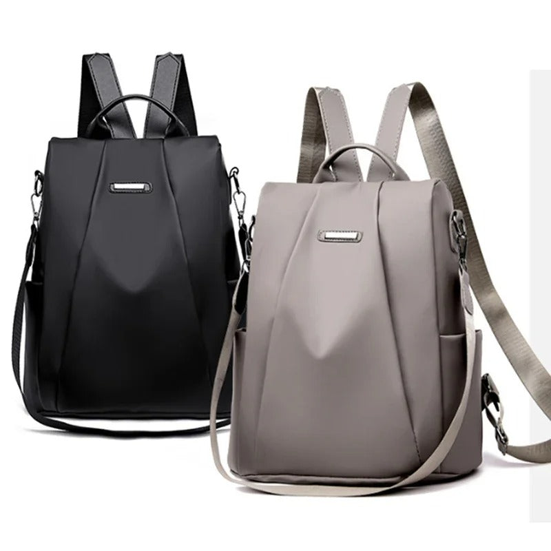 Close-up of the premium water-resistant nylon fabric of a women's multi-way lightweight everyday bag.