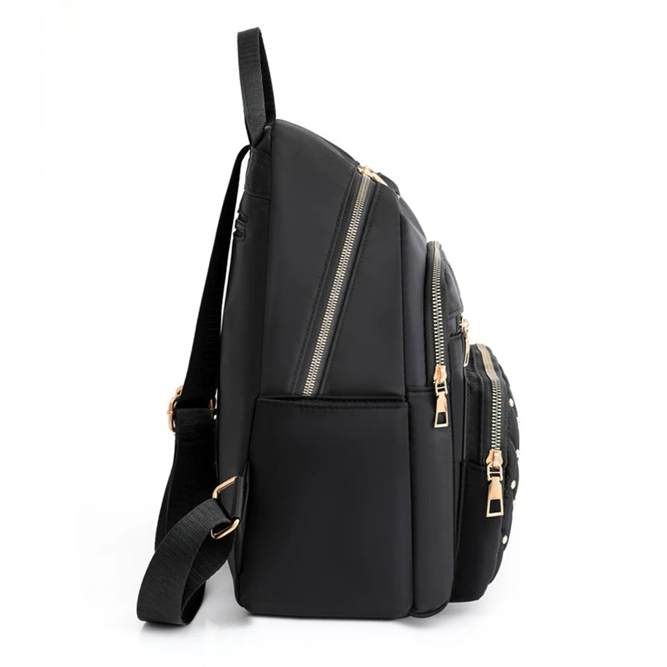 Stylish women's lightweight water-resistant nylon backpack for comfortable travel and adventures.