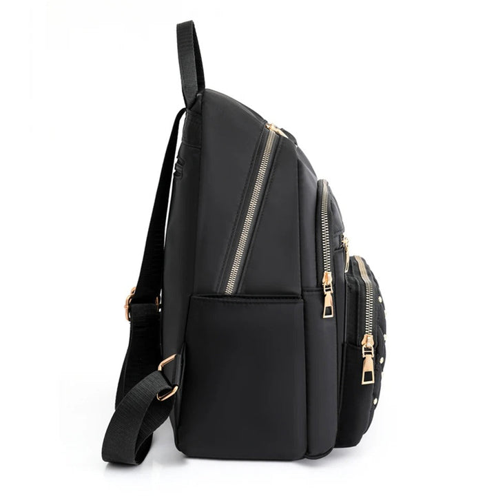 Stylish women's lightweight water-resistant nylon backpack for comfortable travel and adventures.