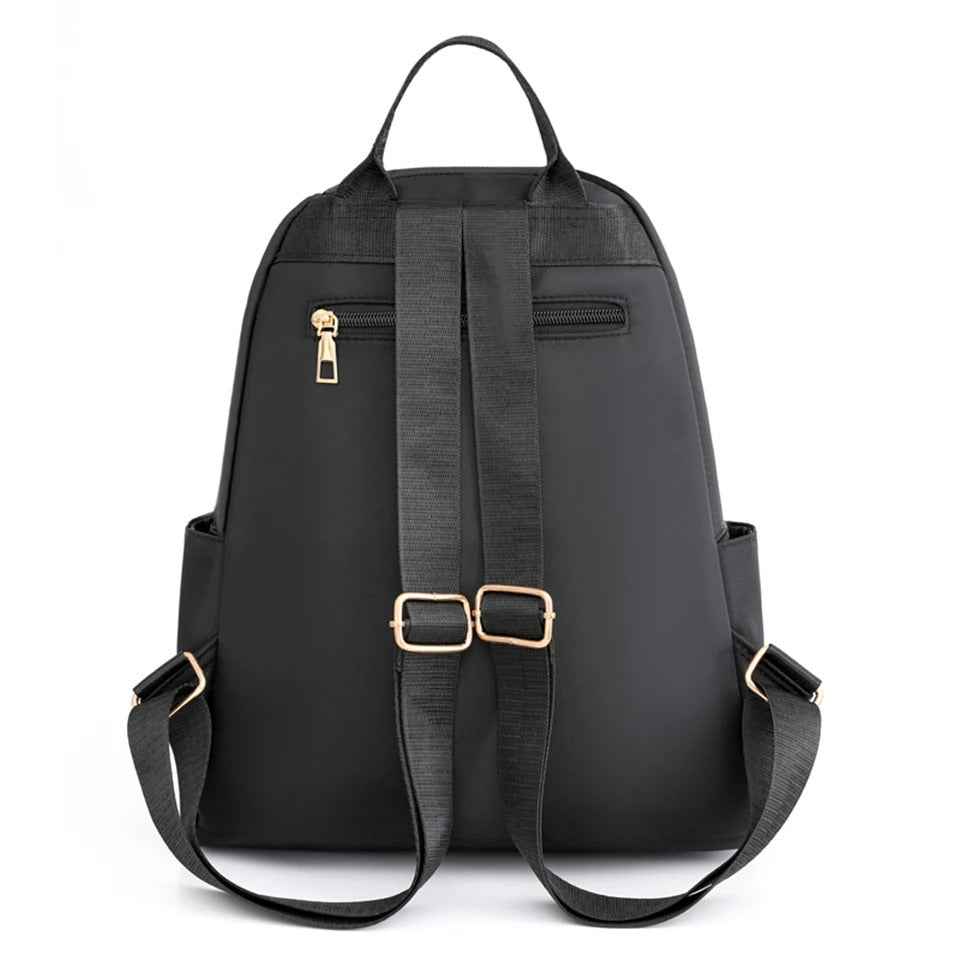 Practical women's lightweight nylon backpack, water-resistant, ideal for school or daily commuting.