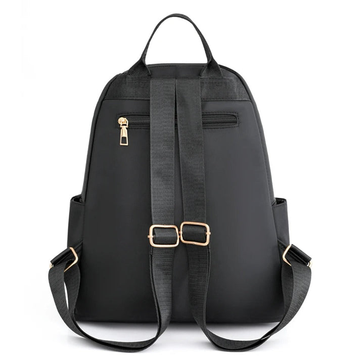 Practical women's lightweight nylon backpack, water-resistant, ideal for school or daily commuting.