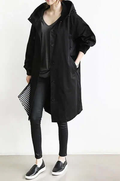 Elegant women's lightweight waterproof rain cape for ultimate outdoor protection and style.