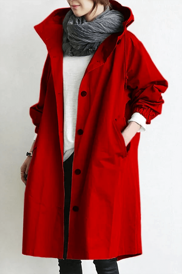 Modern women's waterproof outerwear, a lightweight rain cape designed for fashion and function.