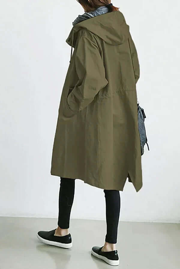 Durable women's lightweight rain cape. Waterproof jacket, ideal for travel & outdoor fashion.