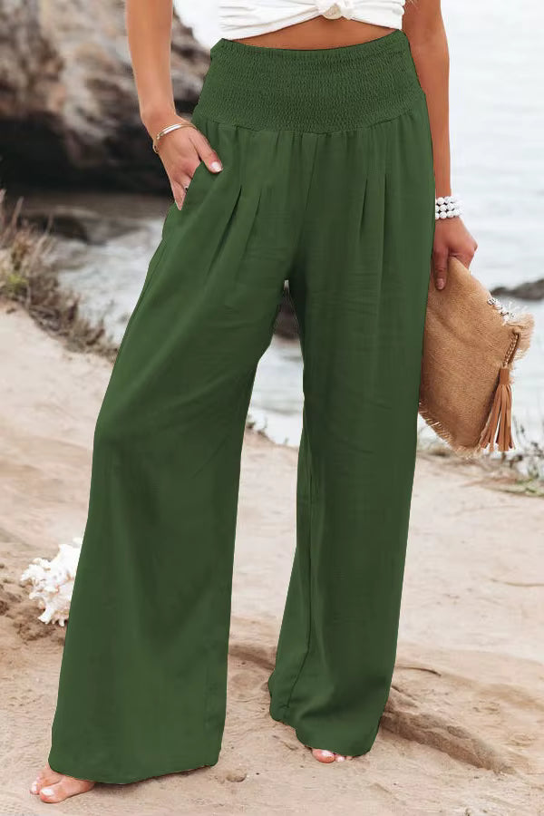 Back view of women's lightweight wide leg linen trousers, highlighting the comfortable smocked waist.