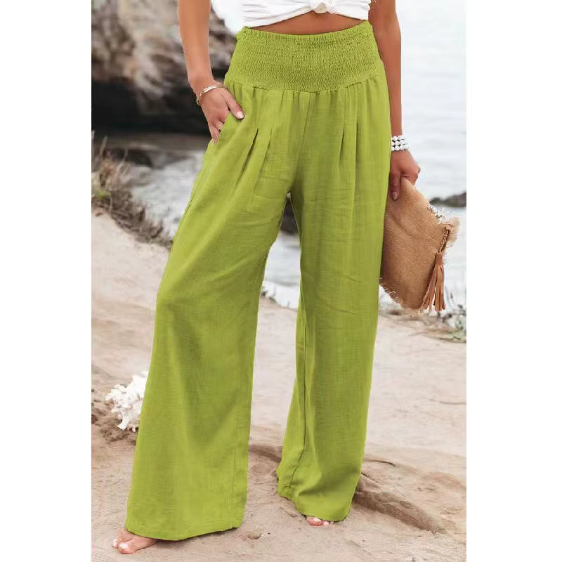Side profile of elegant women's wide leg linen trousers, showcasing their relaxed summer fit.