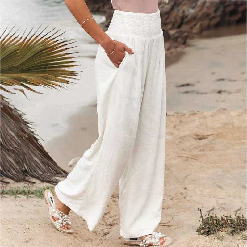 Breathable and lightweight women's linen trousers with wide legs, great for summer comfort.