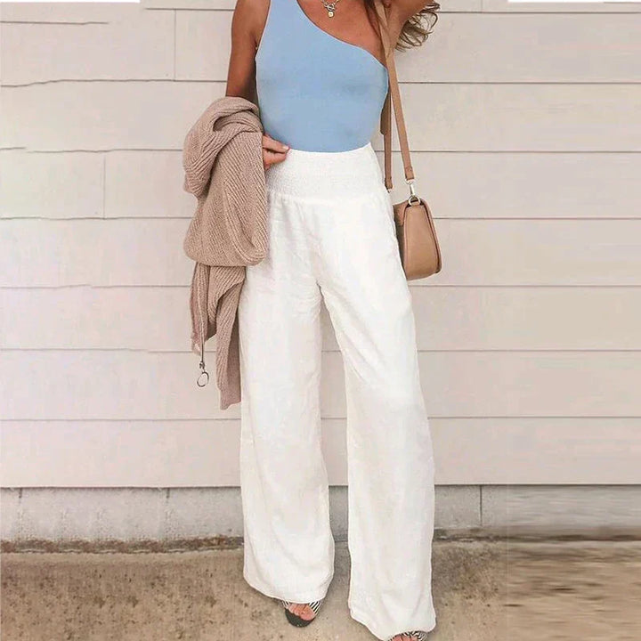 Comfortable smocked waist wide leg linen trousers for women, versatile for summer outfits.