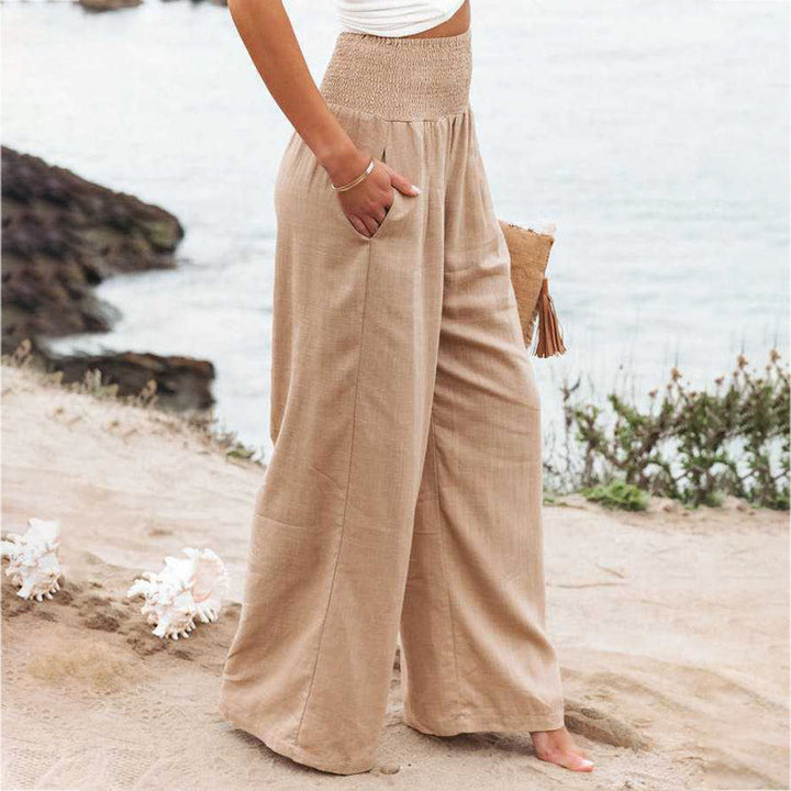 Versatile women's linen trousers with wide legs, combining casual comfort and elegant style.