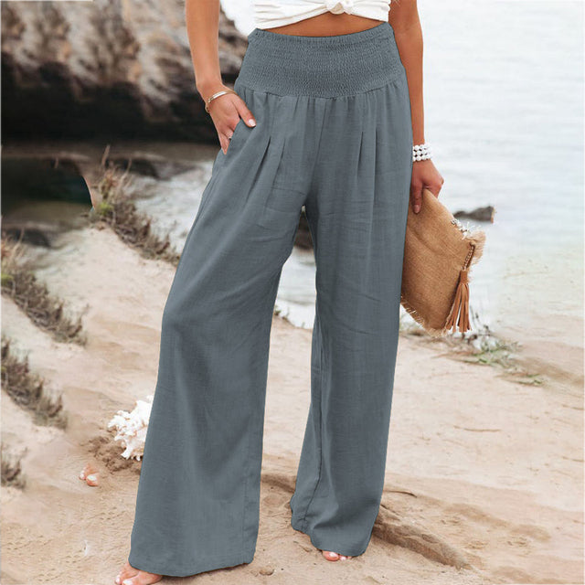 Women's summer fashion wide leg linen trousers, featuring a breathable fabric and smocked waist.