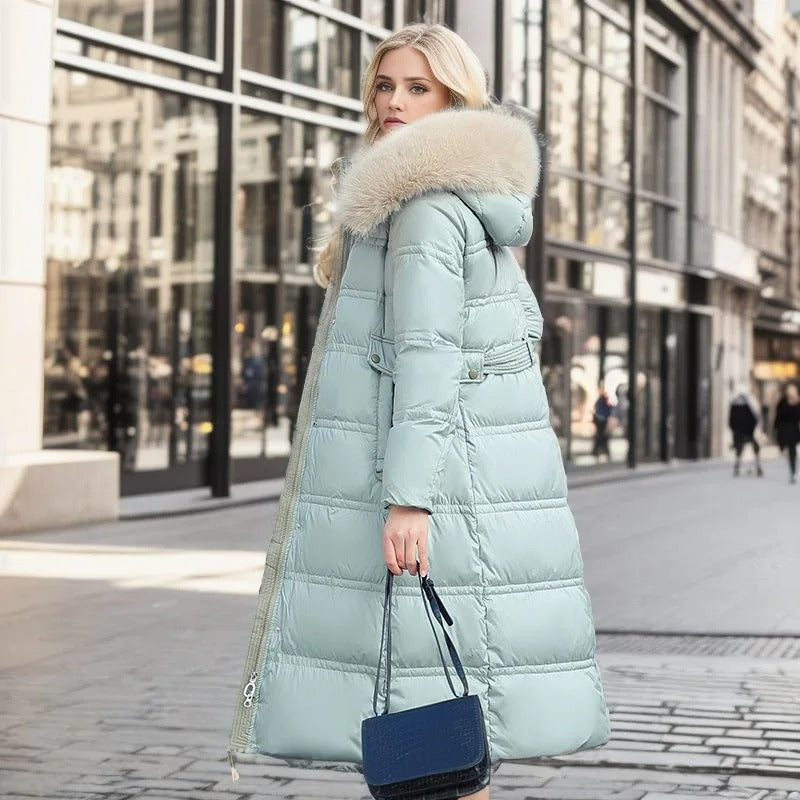 Long-length women's winter coat, puffer style with a high collar, offering full body warmth.
