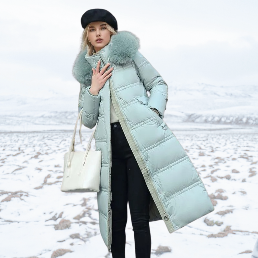 Contemporary women's long puffer coat with a prominent high collar, great for urban winter fashion.