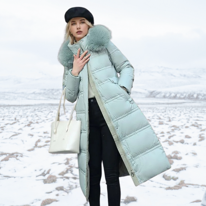 Contemporary women's long puffer coat with a prominent high collar, great for urban winter fashion.