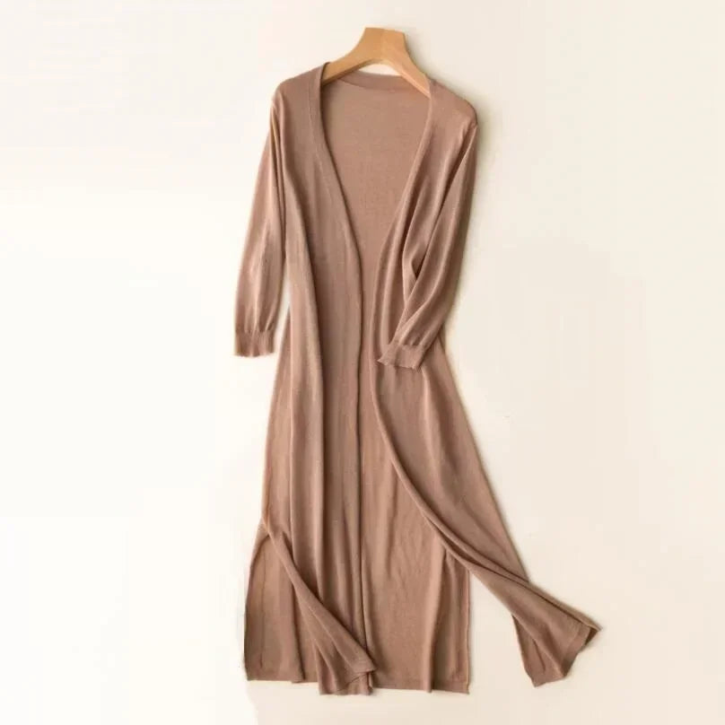 Flowy women's long open front cardigan, showcasing its relaxed fit & stylish layering potential.