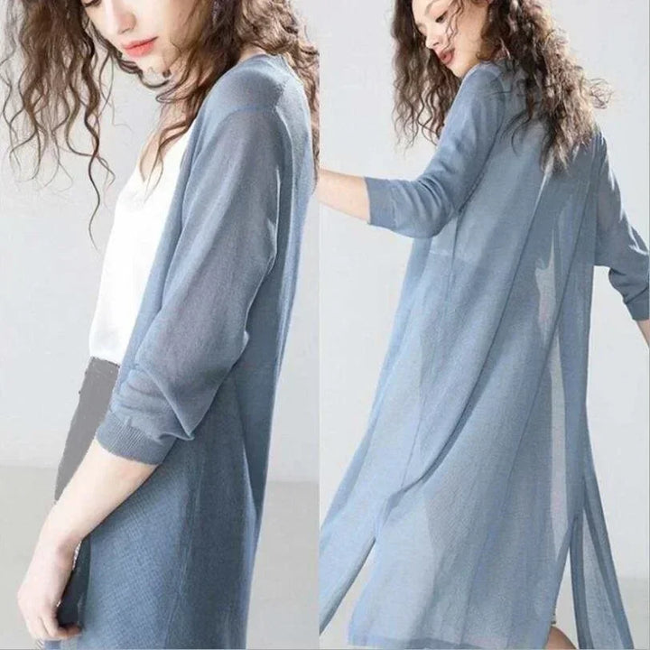 Back view of a women's long open front cardigan, showcasing its elegant drape & comfortable fit.