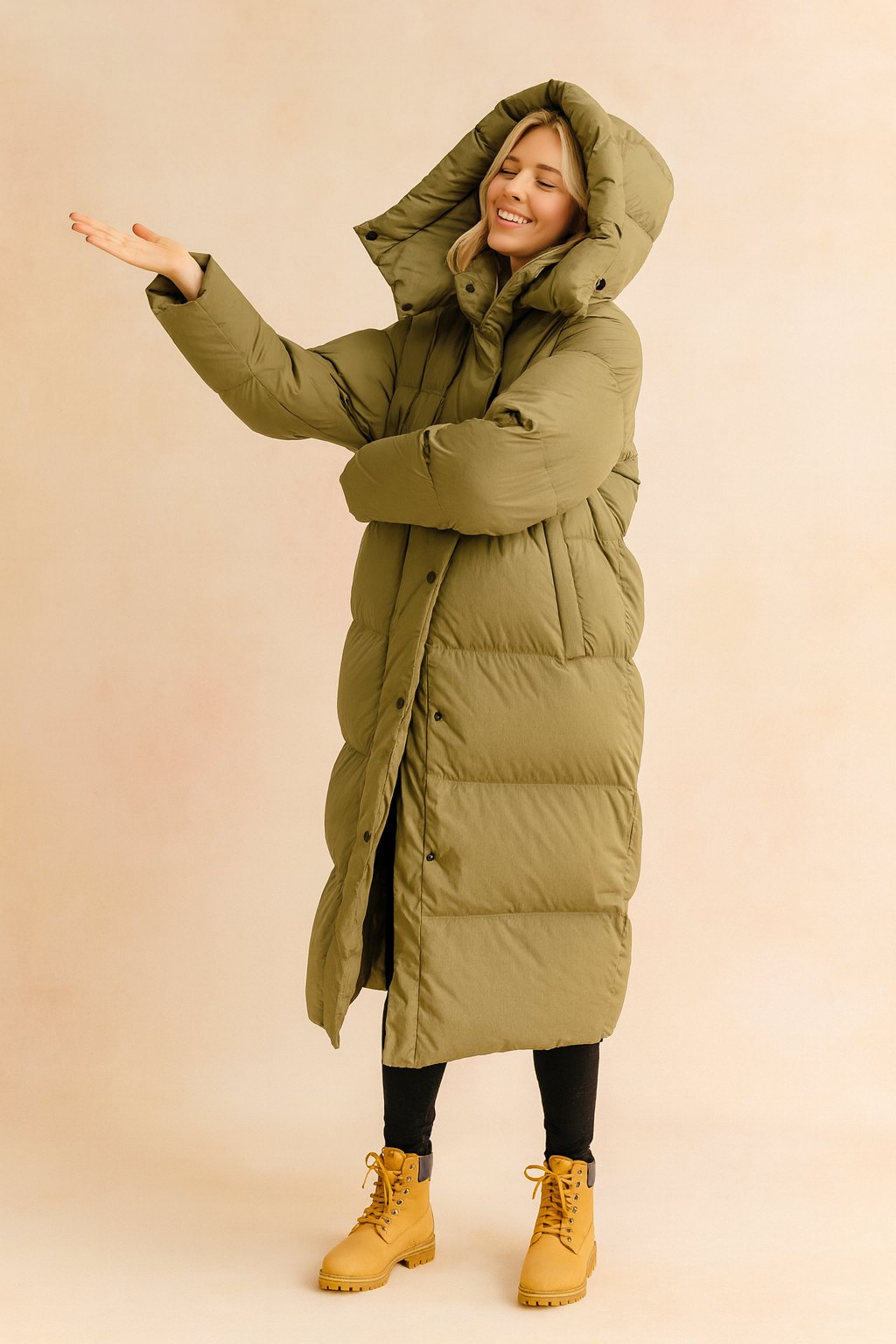 Women's long quilted winter jacket with a warm hood. Perfect chic outerwear for cold weather.